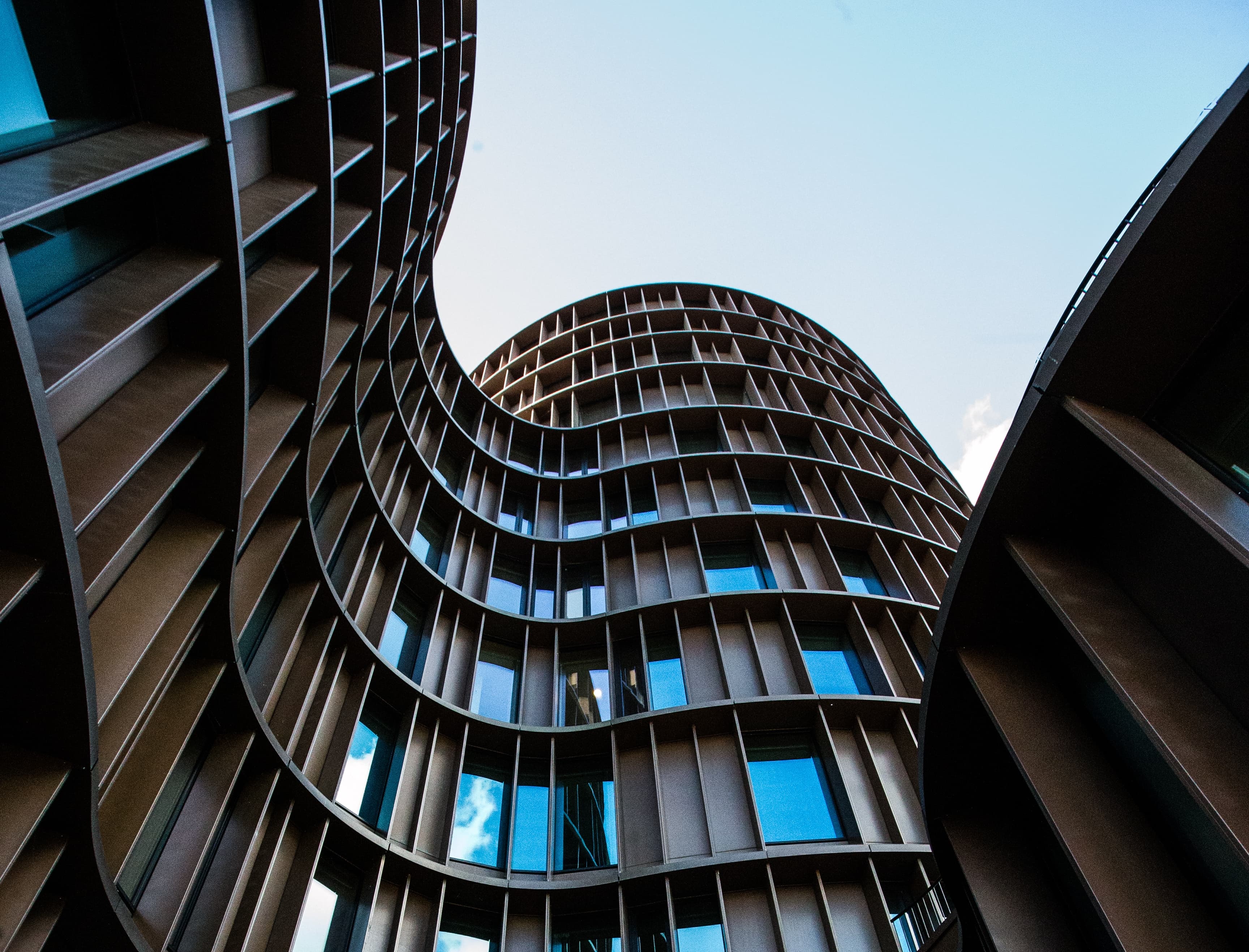 Curved contemporary architecture viewed from below